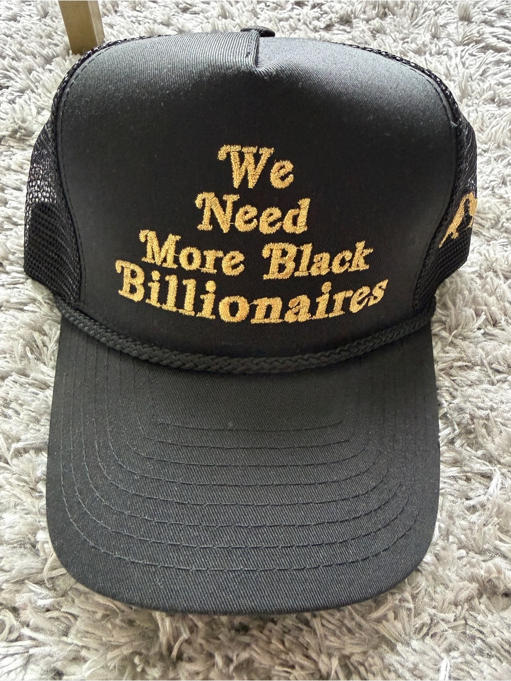'We Need More Black Billionaires' Black Trucker Hat with Gold Embroidered